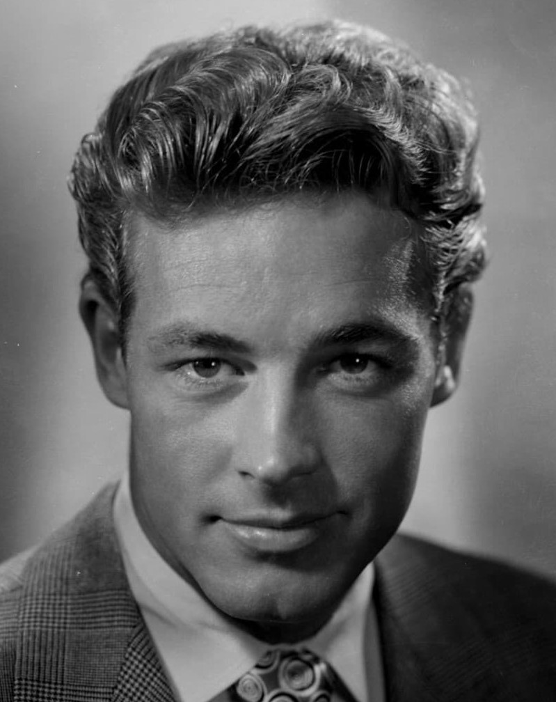 El remolino en la frente de Guy Madison
