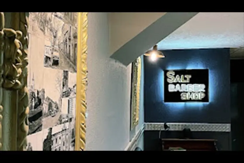 interno barberia logo